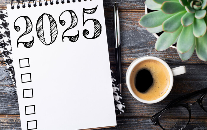 pilates fitness goals 2025, notebook, warm drink, glasses, plant
