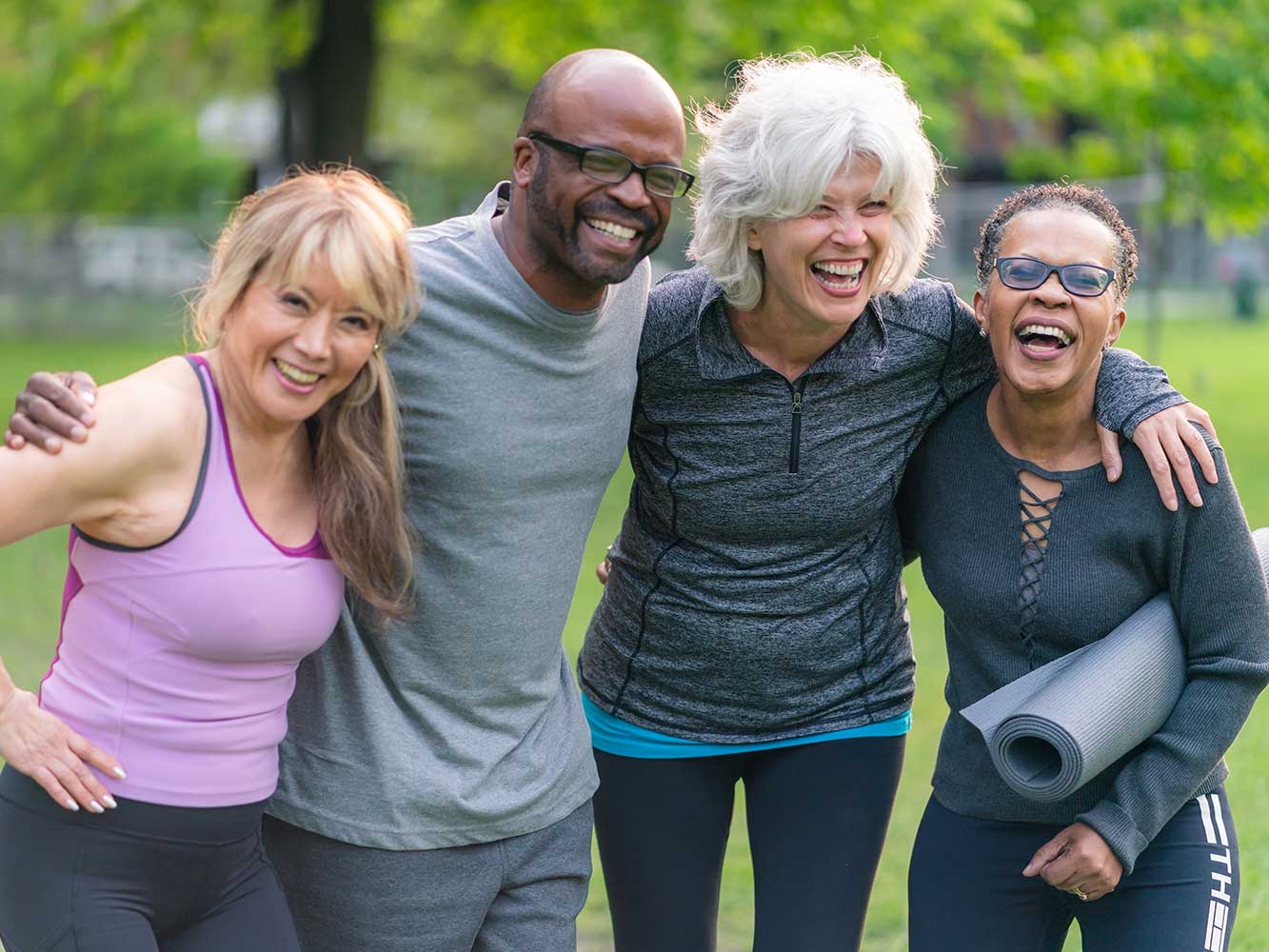 Connection-Longevity-PLF Pilates longevity connection, group of four adults outdoors, athletic clothing, smiling